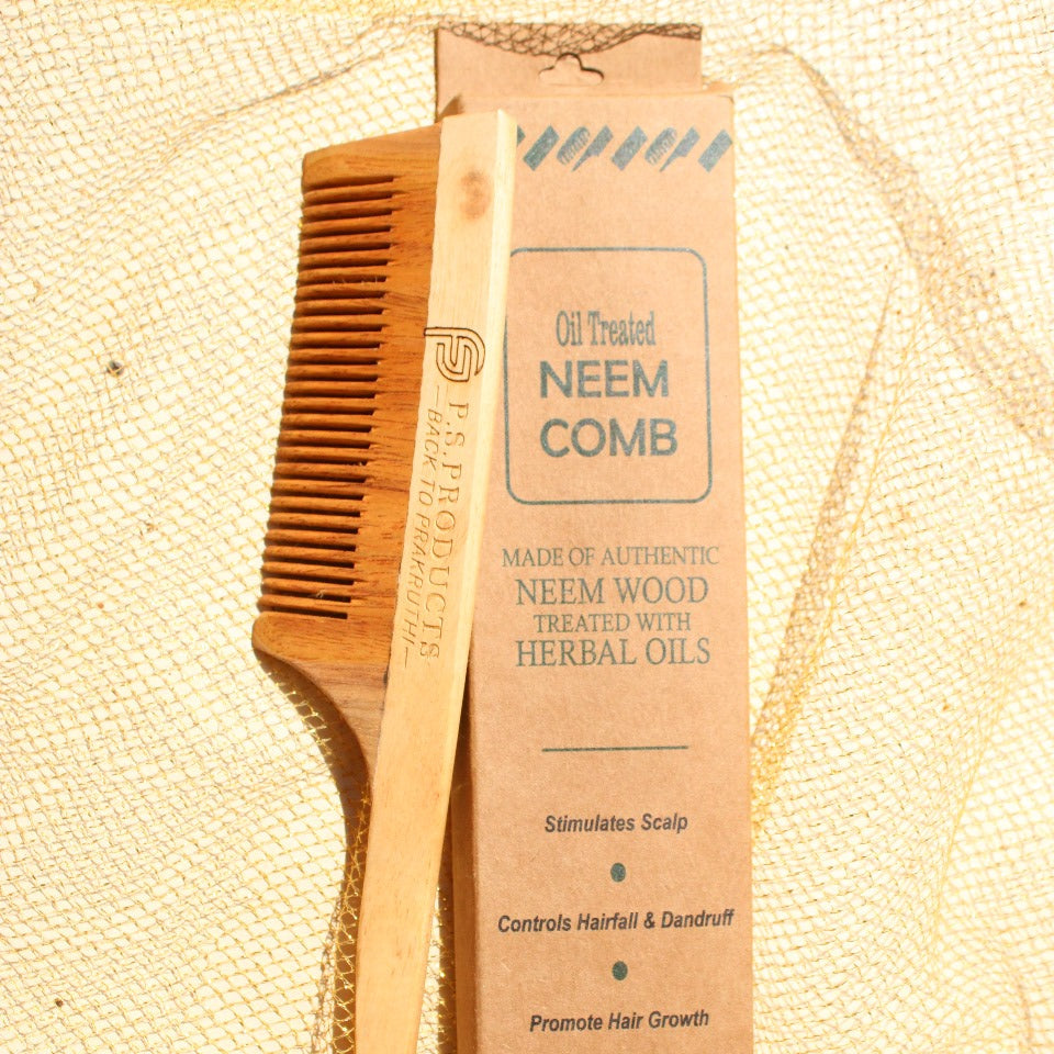Neem comb and packaging on a textured beige background
