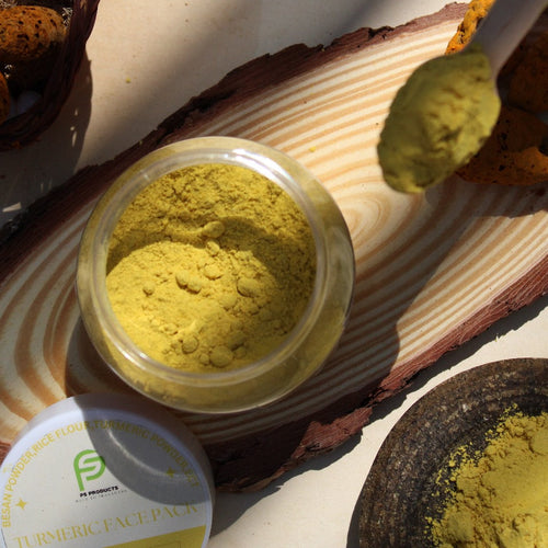 Jar of yellow powder on a wooden surface with a label