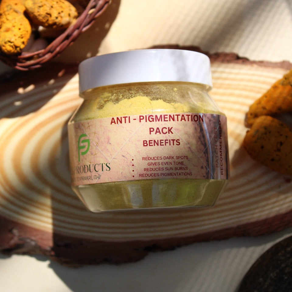 Jar of anti-pigmentation pack with a textured surface and cookies in the background