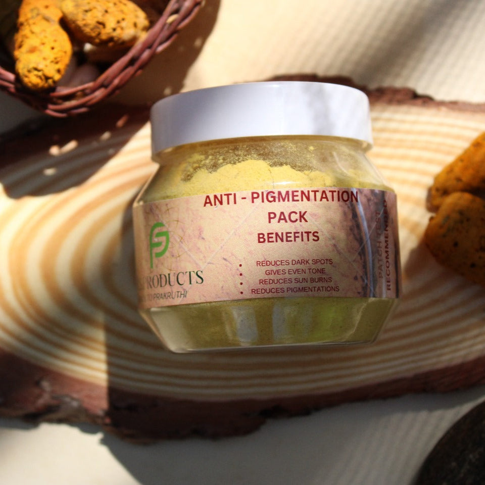 Jar of anti-pigmentation pack with a textured surface and cookies in the background